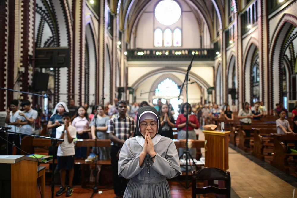 A Myanmar's Catholic nun prays