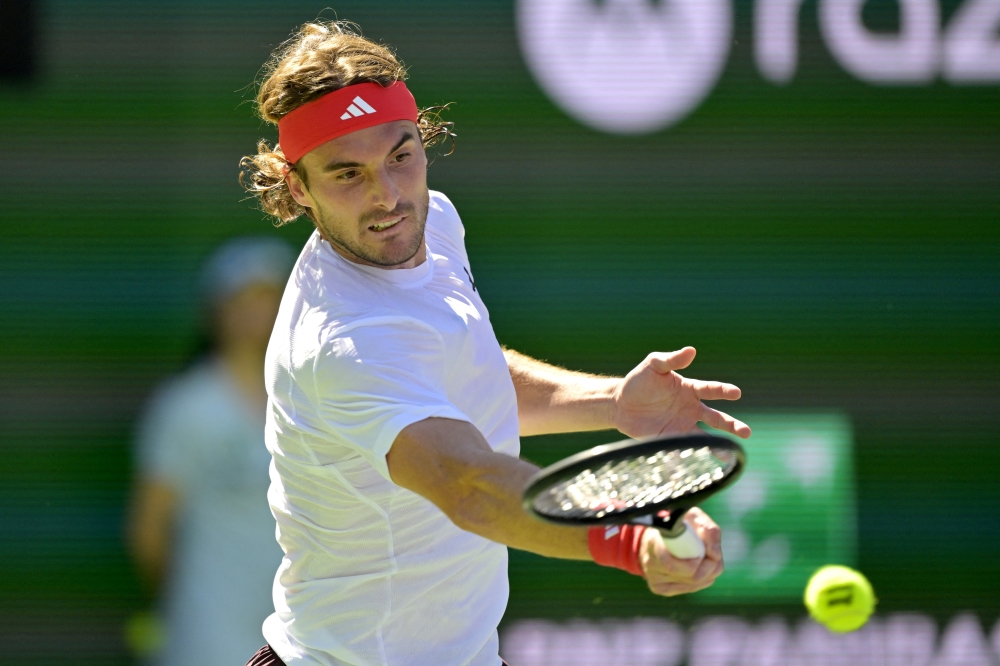 Mar 9, 2025; Indian Wells, CA, USA;  Stefanos Tsitsipas (GRE) hits a shot as he defeats Matteo Berrettini (not pictured) in the third round of the BNP Paribas Open at the Indian Well Tennis Garden. Mandatory Credit: Jayne Kamin-Oncea-Imagn Images
