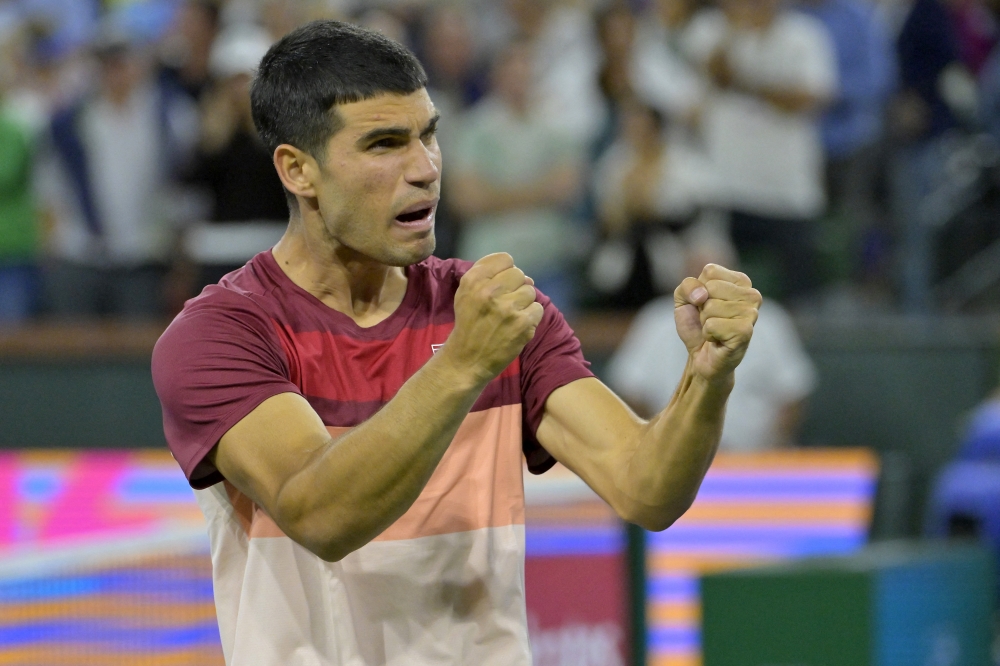 Mar 10, 2025; Indian Wells, CA, USA;  Carlos Alcaraz (ESP) celebrates after defeating Denis Shapovalov (not pictured) in his third round match at the BNP Paribas Open at the Indian Well Tennis Garden. Mandatory Credit: Jayne Kamin-Oncea-Imagn Images
