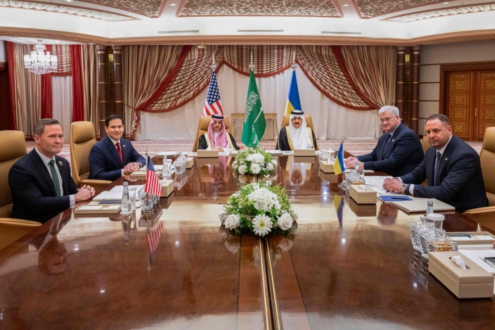 TOPSHOT - US Secretary of State Marco Rubio (2nd L), US National Security Advisor Mike Waltz (L), Ukrainian Foreign Minister Andrii Sybiha (3rd R), Ukrainian Head of Presidential Office Andriy Yermak (2nd R), and Ukrainian Minister of Defense Rustem Umerovto (R) hold a meeting in Jeddah in the presence of Saudi Foreign Minister Faisal bin Farhan (3L) and National Security Advisor Mosaad bin Mohammad al-Aiban (C) on March 11, 2025. In the Saudi-hosted talks, Ukraine is to present the US with a plan for a partial ceasefire with Russia, hoping to restore support from its key benefactor, which under President Donald Trump has demanded concessions to end the three-year war. (Photo by SAUL LOEB / POOL / AFP)
