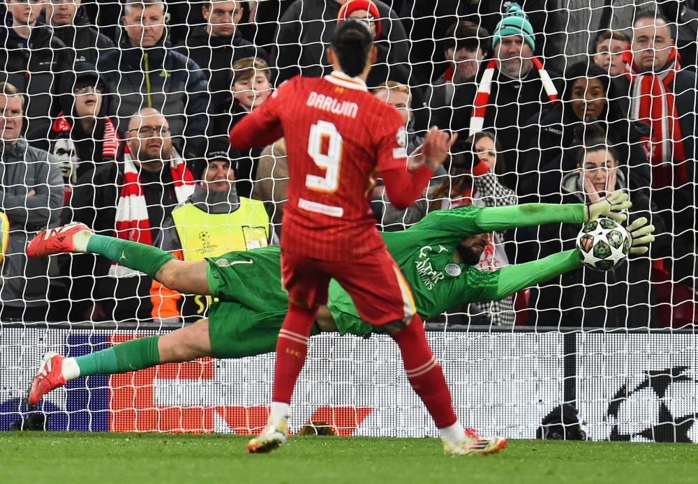 Soccer Football - Champions League - Round of 16 - Second Leg - Liverpool v Paris St Germain - Anfield, Liverpool, Britain - March 11, 2025 Liverpool's Darwin Nunez has his shot saved by Paris St Germain's Gianluigi Donnarumma during the penalty shoot-out REUTERS/Peter Powell     TPX IMAGES OF THE DAY
