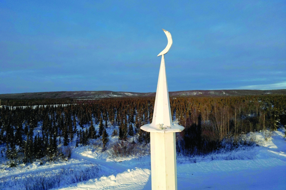CANADA: The Midnight Sun Mosque's minaret is seen as devotees prepare to break their fast for Iftar during Ramadhan in Inuvik, Canada. - AFP

