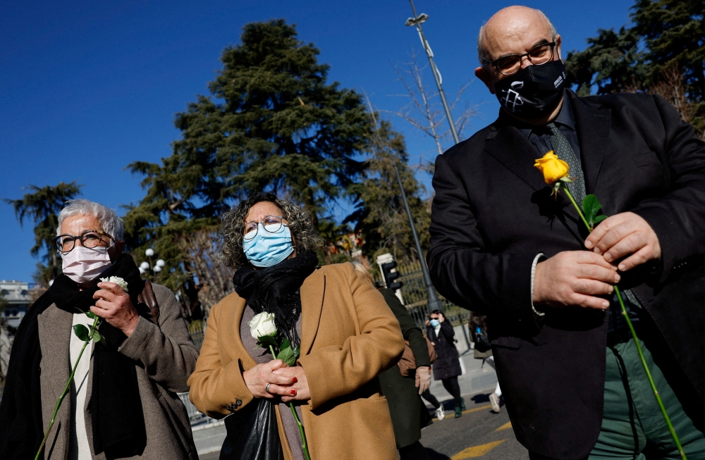 Angela Arreba, Enriqueta Lopez and Amnesty International's director Esteban Beltran attend a tribute to the Spanish nursing-home residents who died during Covid-19's devastating first wave in Madrid. - Reuters File
