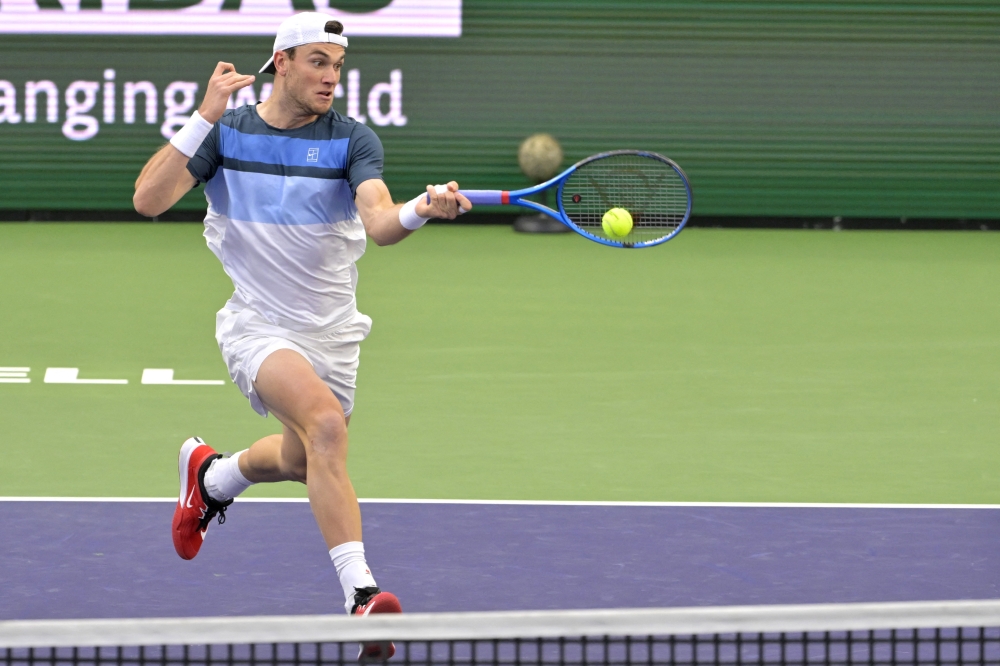 Mar 13, 2025; Indian Wells, CA, USA; Jack Draper (GBR) his a shot as he defeated Ben Shelton during his quarterfinal match against (not pictured) in the BNP Paribas Open at the Indian Well Tennis Garden. Mandatory Credit: Jayne Kamin-Oncea-Imagn Images
