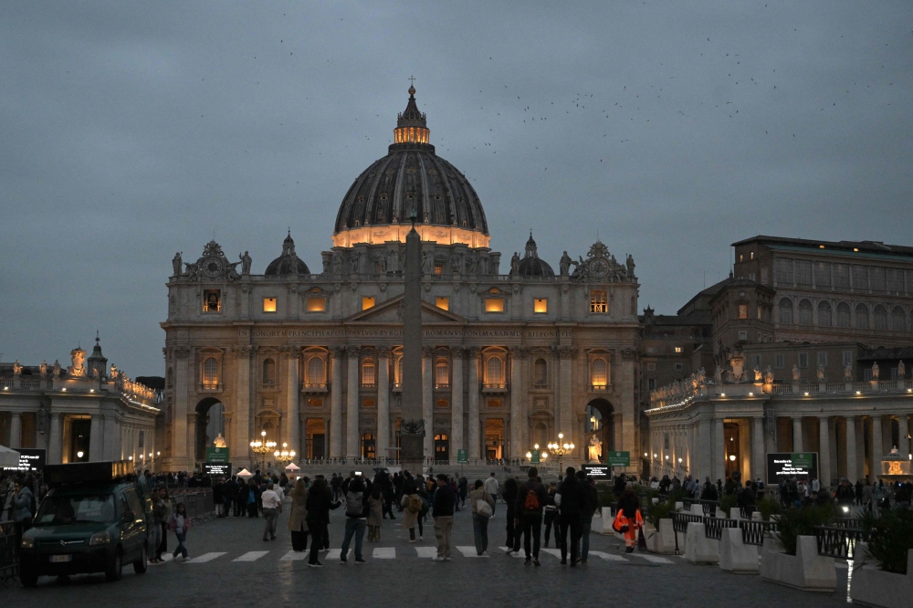 A picture shows the lights of St Peter's basilica in The Vatican. — AFP