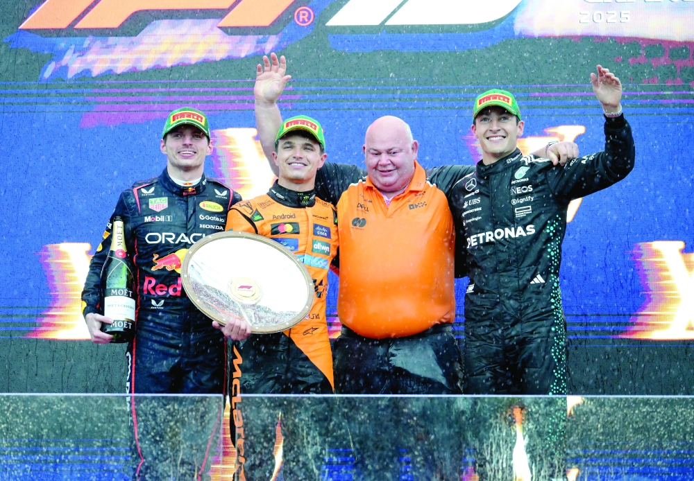 McLaren's Norris celebrates on podium. — Reuters