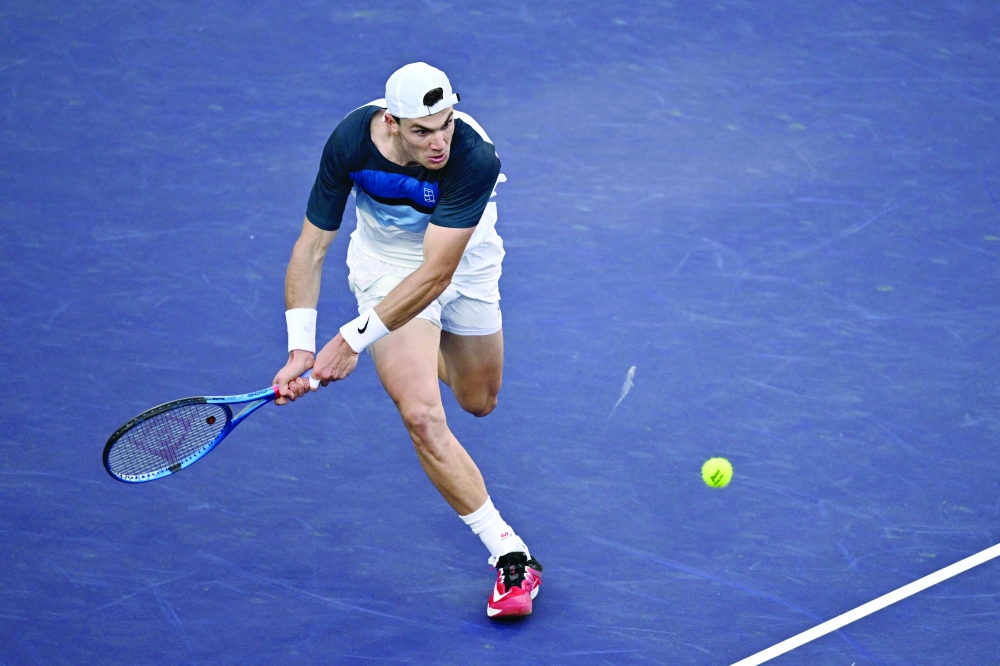 Draper returns ball to Alcaraz during semifinal. — AFP