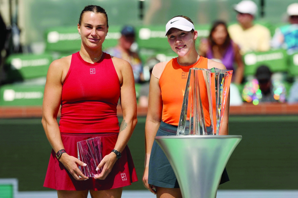 Winner Russia's Mirra Andreeva (R) and Belarus' Aryna Sabalenka pose with their trophies during the women's singles final tennis match at the BNP Paribas Open. — AFP