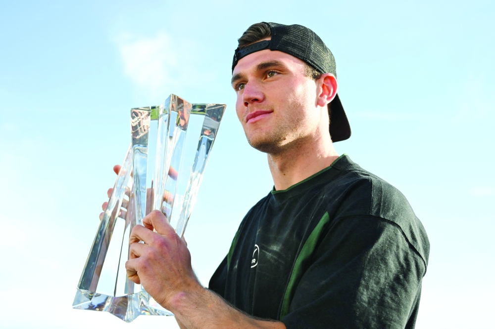 Jack Draper stands for a portrait with his trophy after winning the men's singles match against Denmark's Holger Rune during the BNP Paribas Open at the Indian Wells Tennis Garden. — AFP