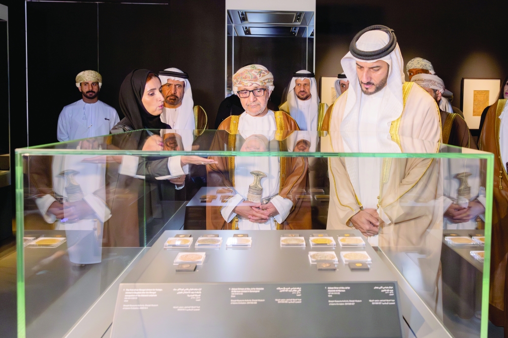 Salim bin Mohammed al Mahrouqi and Shaikh Sultan bin Ahmed al Qasimi watch the rare artefacts being showcased