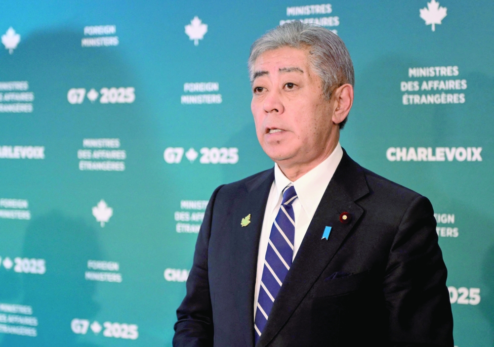 Minister of Foreign Affairs of Japan Takeshi Iwaya speaks to the media in La Malbaie, Quebec. — AFP