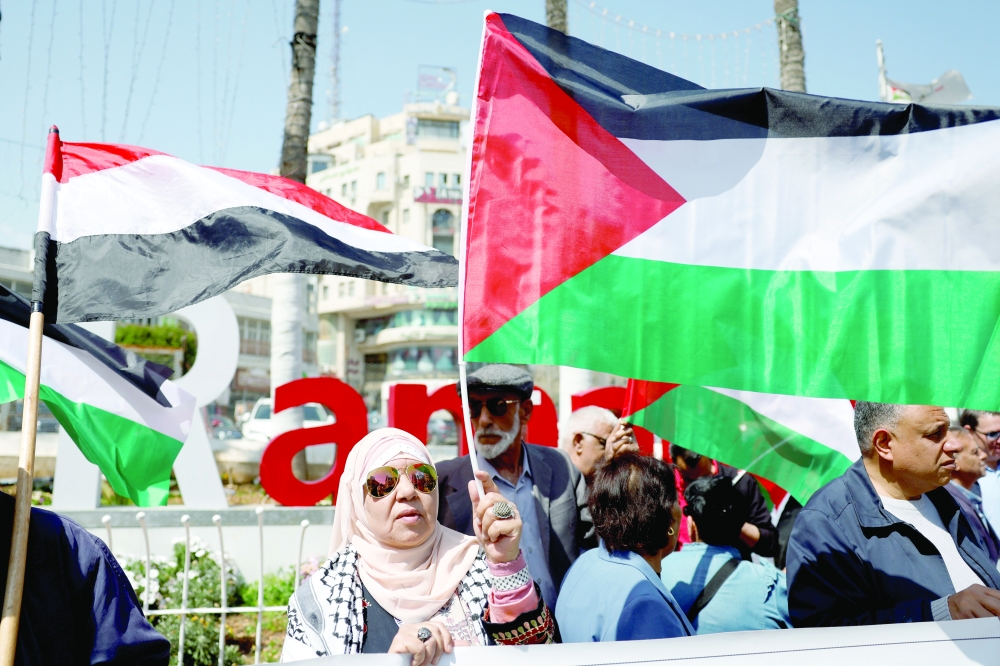 Palestinians protest against renewed war on Gaza, in Ramallah, in the Israeli-occupied West Bank. — Reuters