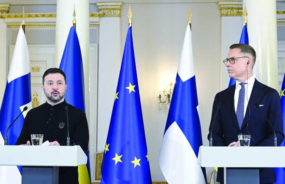 Ukrainian President Volodymyr Zelensky (L) speaks as Finnish President Alexander Stubb listens, at the Presidential Palace in Helsinki. — AFP