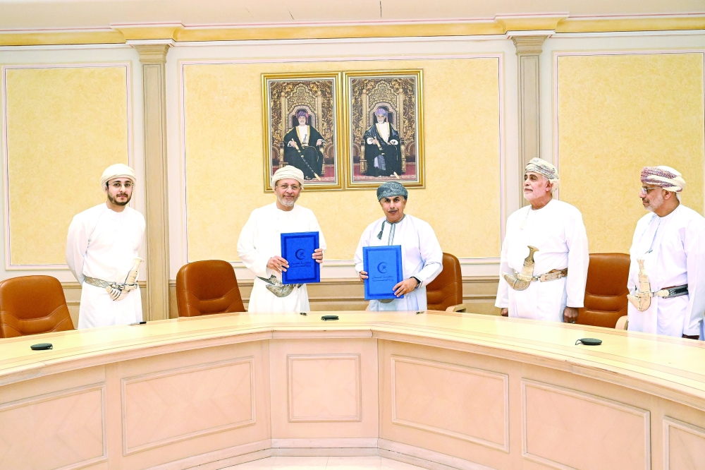 Dr Hilal bin Ali al Sabti, Minister of Health, with officials after signing the agreement on Wednesday