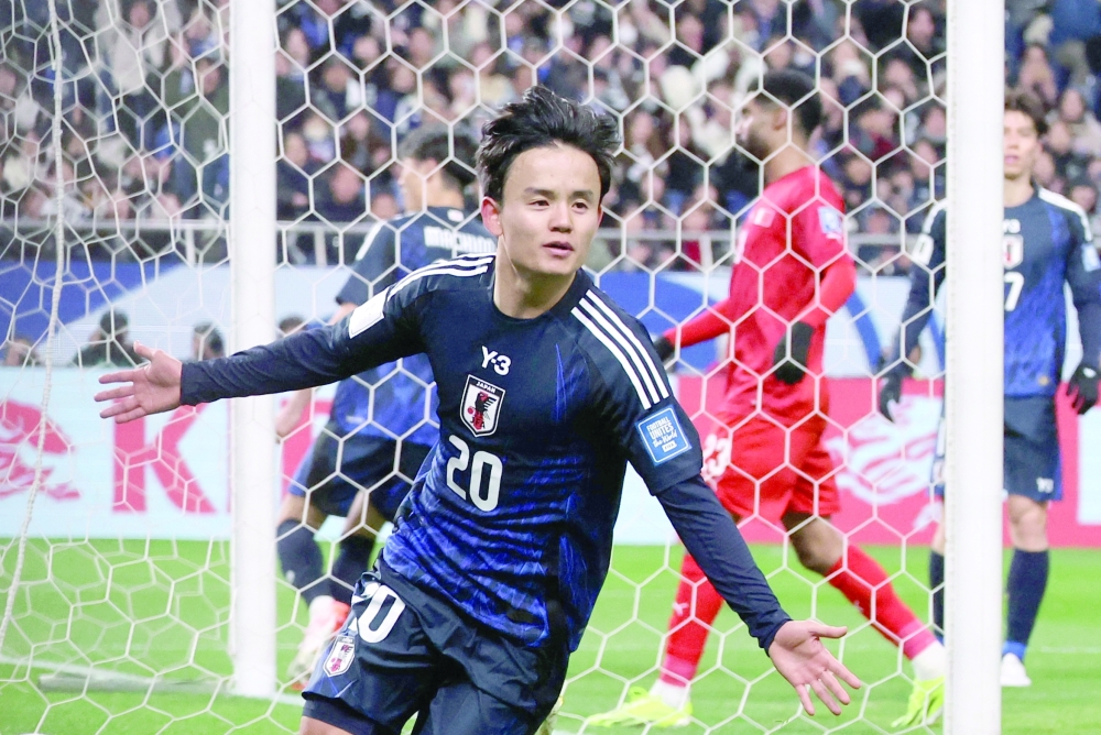 Japan's Takefusa Kubo celebrates scoring their second goal. —  Reuters
