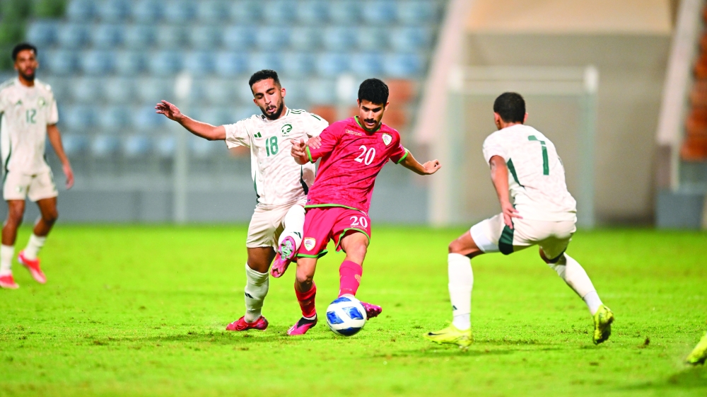 Oman and Saudi Arabia players in action. — Abdulwahid al Hamadani