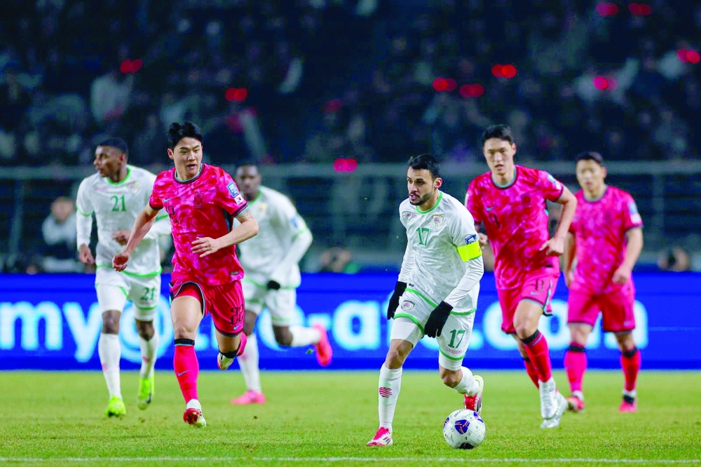 Oman's Ali al Busaidy in action against South Korea.
