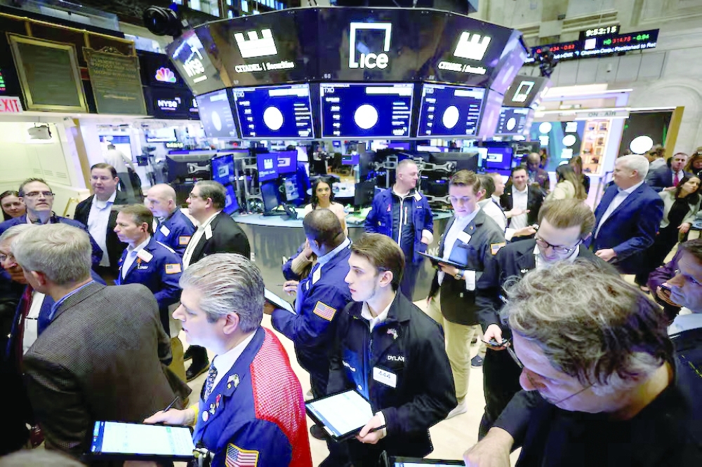 Traders work on the trading floor at the New York Stock Exchange (NYSE) in New York City, US. — Reuters