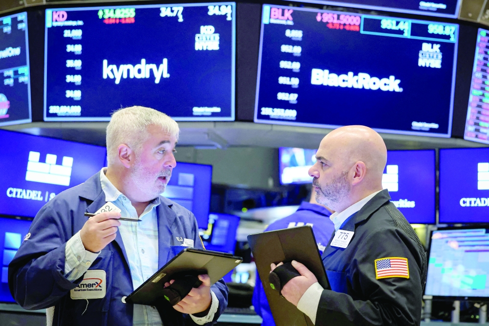 Traders work on the floor at the New York Stock Exchange (NYSE) in New York City. — Reuters