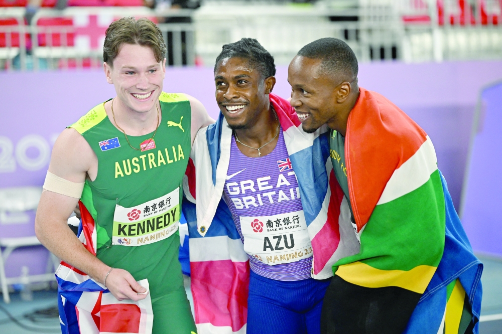 Britain's Jeremiah Azu celebrates winning the Men's 60m Final with second placed Australia's Lachlan Kennedy and third placed South Africa's Akani Simbine 