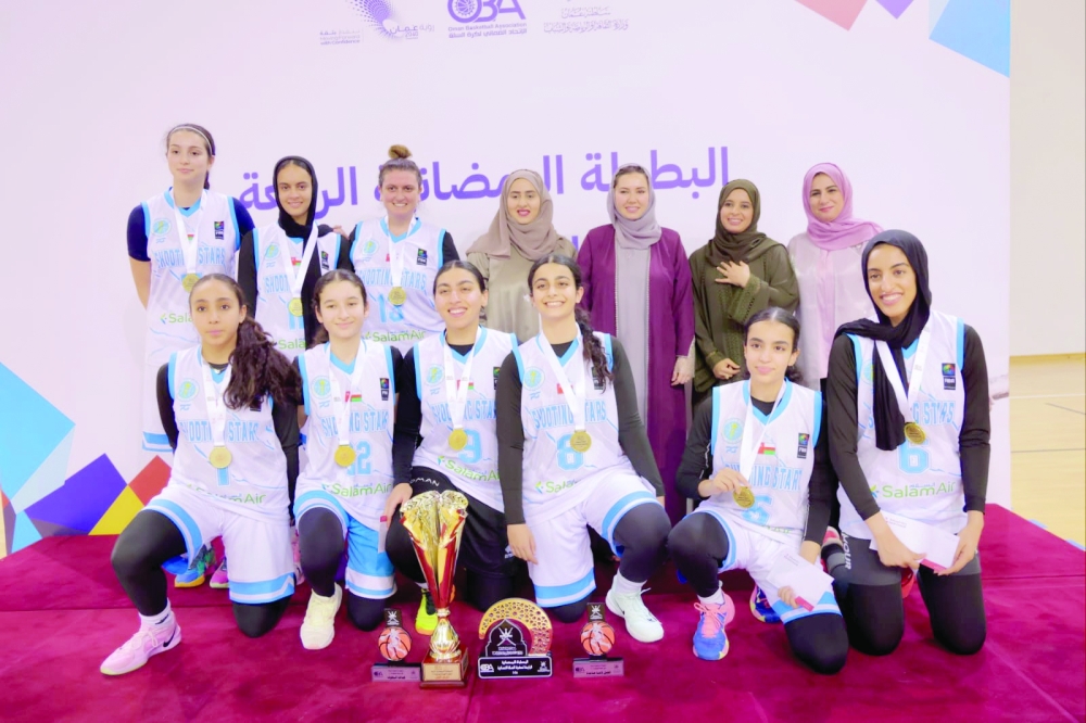 Shooting Stars pose with the trophy.