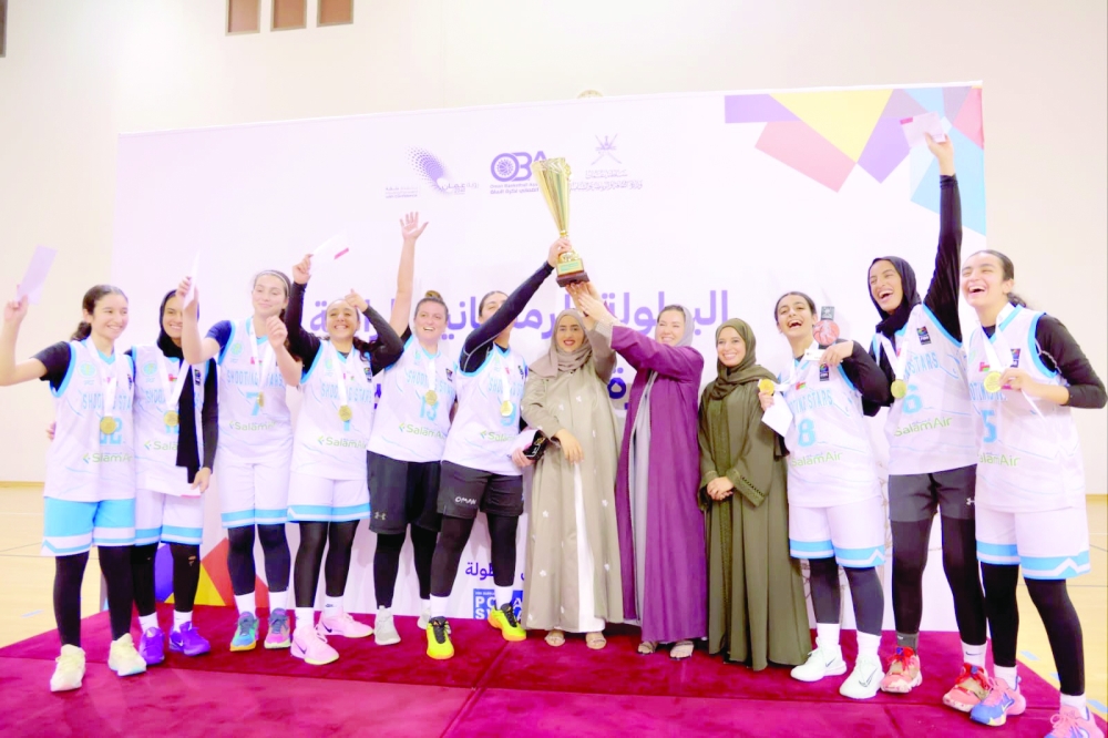 Shooting Stars celebrate with the trophy.