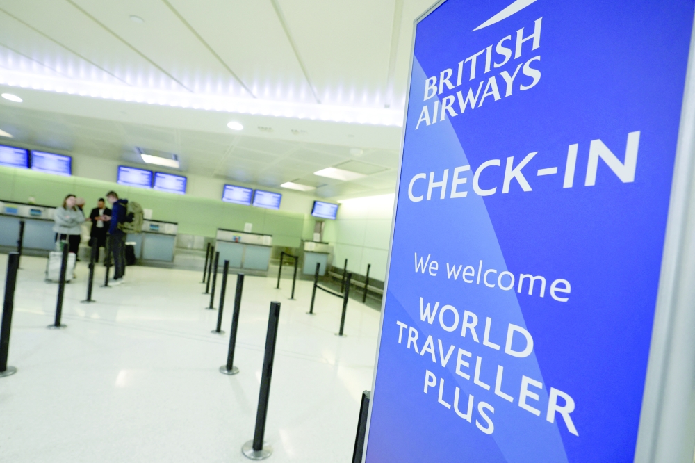 The British Airways check-in area at Newark International Airport stands nearly empty and closed following the closing of London Heathrow Airport after a fire there wiped out the power at Heathrow International Airport, in New Jersey. — Reuters
