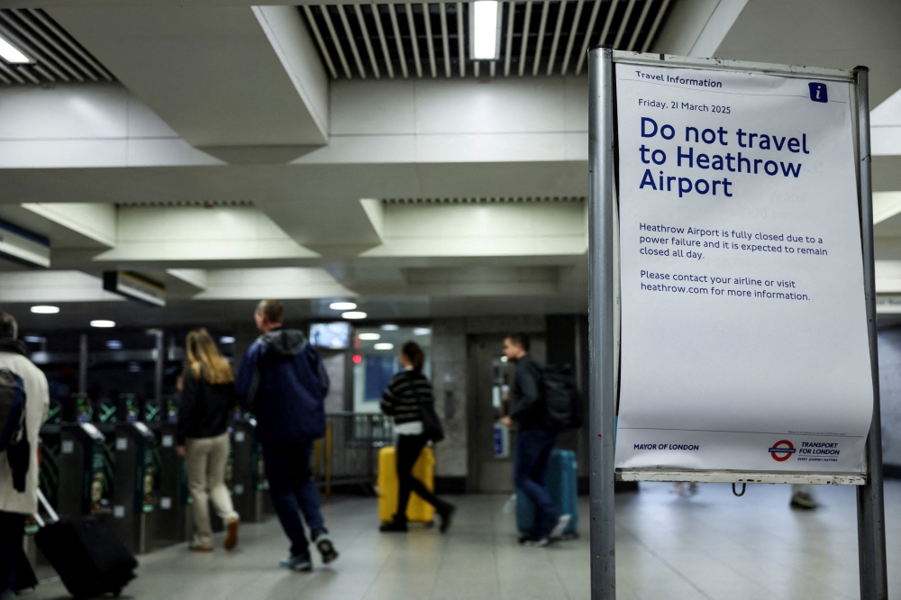 A sign warning to not go to the Heathrow International Airport is placed at Victoria Underground Station