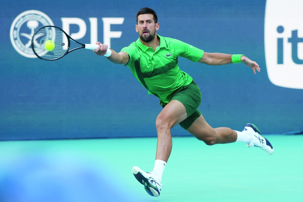 Novak Djokovic reaches for a forehand against Rinky Hijikata on day four of the Miami Open at Hard Rock Stadium. — Reuters