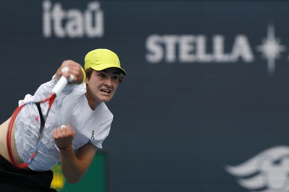 Joao Fonseca serves against Ugo Humbert on day five of the Miami Open at Hard Rock Stadium. — Reuters