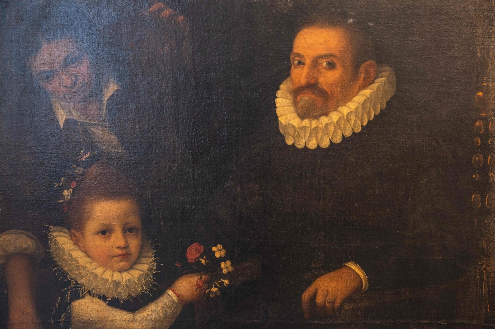 This photograph taken on March 21, 2025, shows a recently discovered painting by Italian artist Lavinia Fontana, titled “Portrait of a Gentleman, his Daughter and a Maid” on display at the Museum de la Chartreuse in Douai, northern France. On March 21, 2025, the Museum de la Chartreuse in Douai presented an unprecedented discovery: a painting by Lavinia Fontana, one of the most important artists of the Italian Renaissance, which had been kept incognito in the museum's storerooms. (Photo by Sameer Al-DOUMY / AFP)

