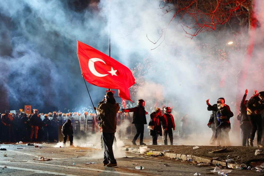 A person carries a Turkish flag