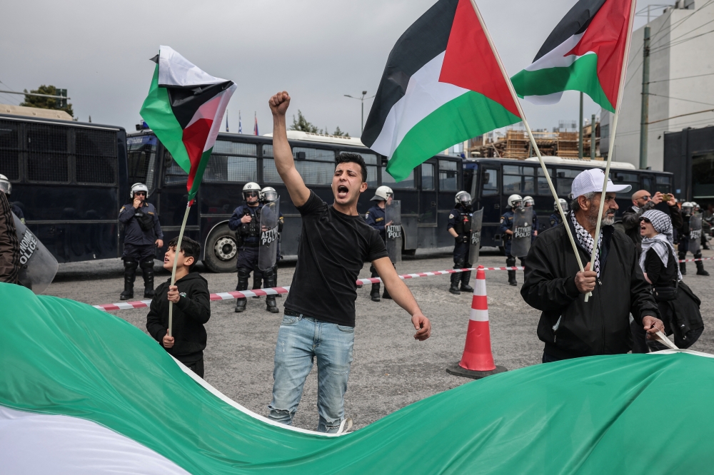 Pro-Palestinian protesters take part in a rally against Israel's operations, in Athens, Greece. — Reuters