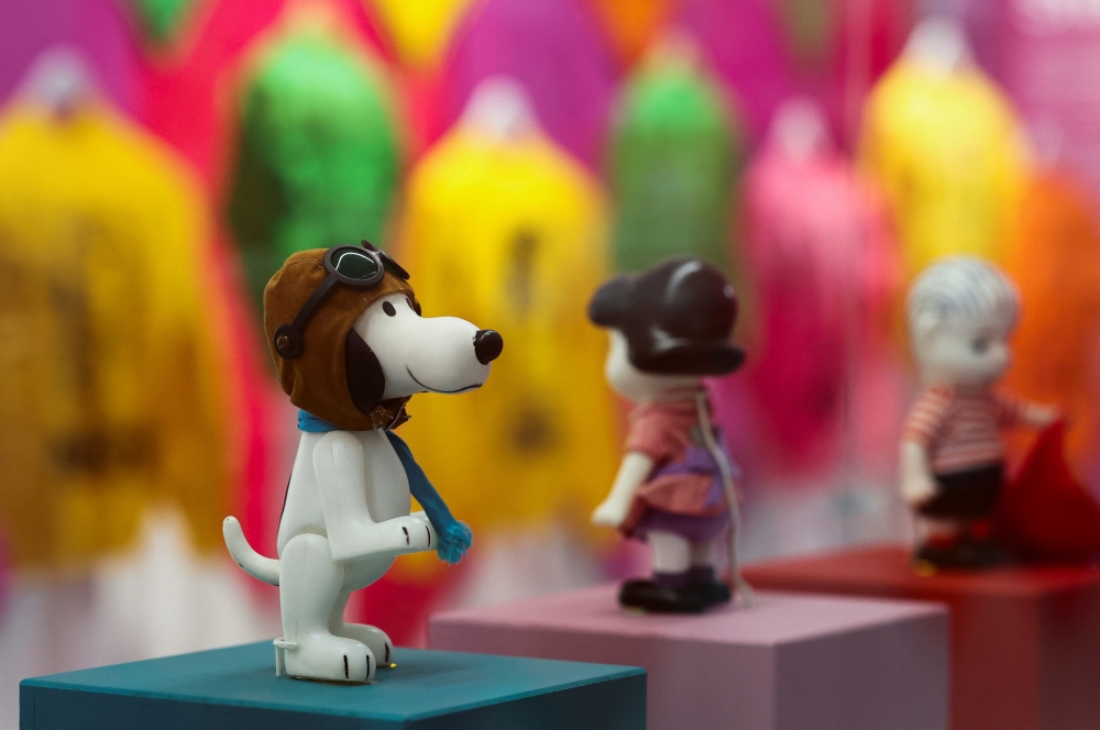 Figurines of "Peanuts" characters are displayed as part of the "Snoopy In Style" exhibition to mark the Peanuts comic strip's 75th anniversary in Paris, France, March 20, 2025. REUTERS/Gonzalo Fuentes
