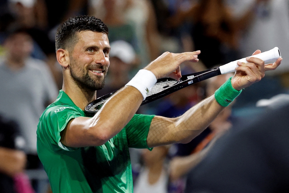 Mar 25, 2025; Miami, FL, USA; Novak Djokovic (SRB) celebrates after his match against Lorenzo Musetti (ITA)(not pictured) on day eight of the Miami Open at Hard Rock Stadium. Mandatory Credit: Geoff Burke-Imagn Images     TPX IMAGES OF THE DAY
