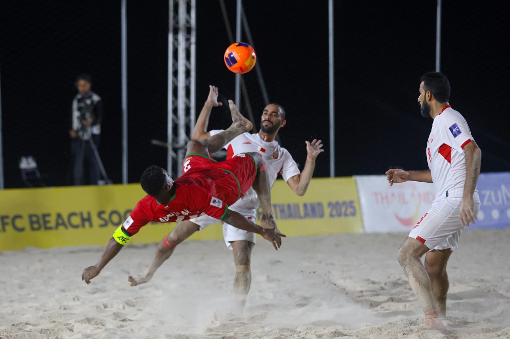 Oman and Bahrain players in action.