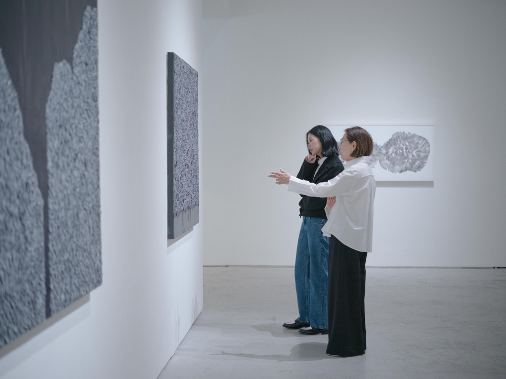 Shelly Wu, left, who runs the gallery TKG , stands in the gallery of her mother, right, at Tina Keng Gallery in Taipei, Taiwan, March 11, 2025. (Lam Yik Fei/The New York Times)