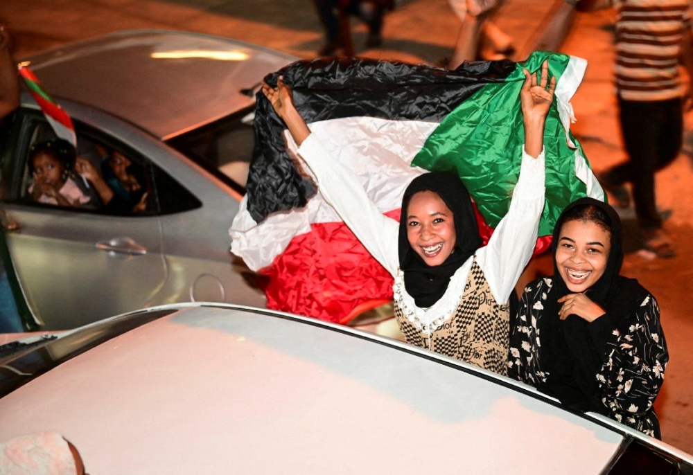 Sudanese citizens celebrate on a street after the Sudanese army deepened its control over the capital Khartoum, from the Rapid Support Forces in Port Sudan, Sudan. - Reuters
