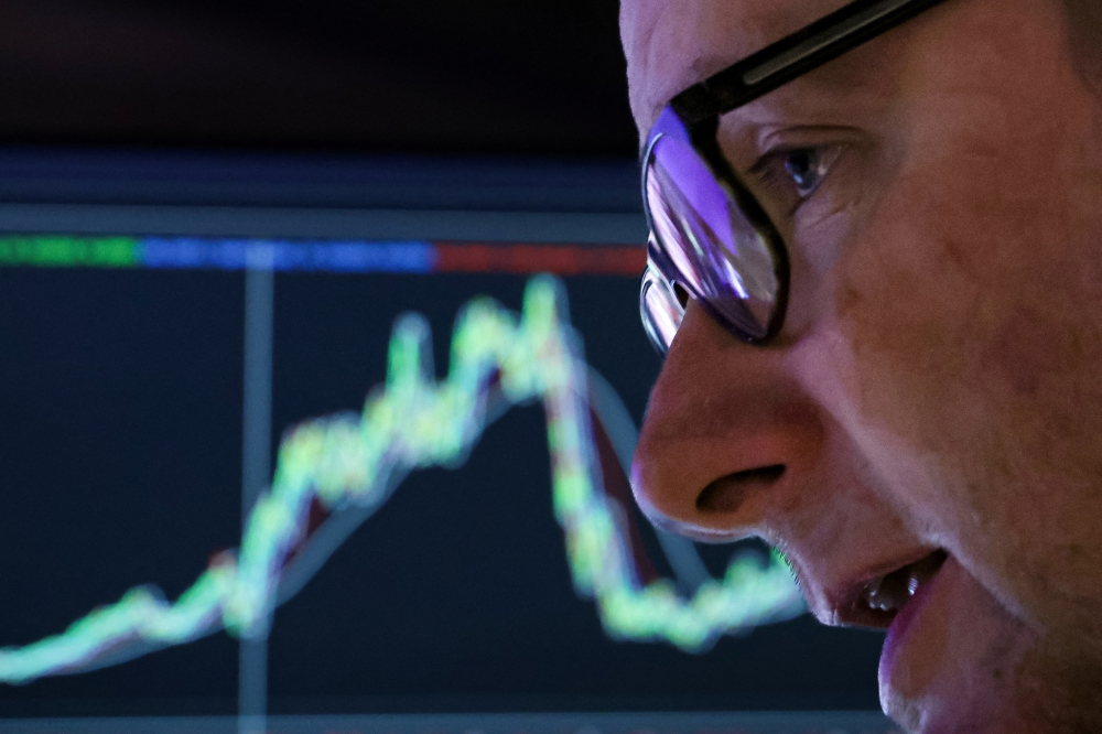 A specialist trader works at his post on the floor at the New York Stock Exchange in New York City. - Reuters