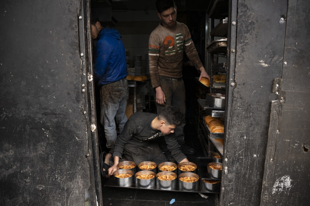 Bakers prepare marook, the sweet bread beloved during Ramadan in Syria, at the Al Jouzeh bakery in Damascus.— NYT