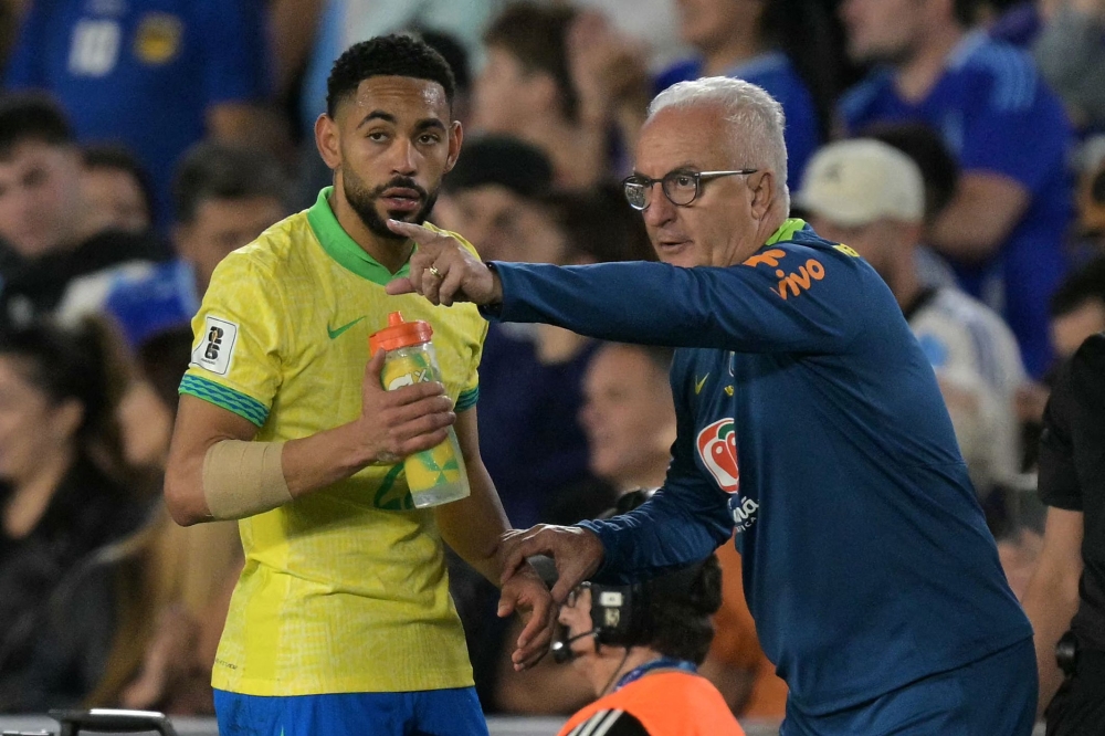 Brazil's head coach Dorival Junior gives instructions to Brazil's forward Matheus Cunha during the 2026 FIFA World Cup South American qualifiers football match between Argentina and Brazil in Buenos Aires. — AFP