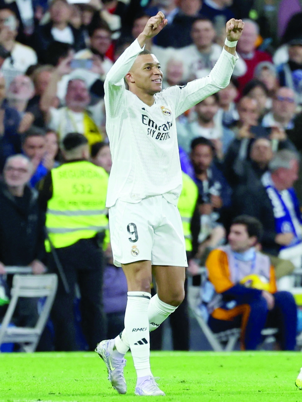 Real Madrid's French forward Kylian Mbappe (L) celebrates scoring their third goal during the Spanish league football match between Real Madrid CF and Club Deportivo Leganes. — AFP