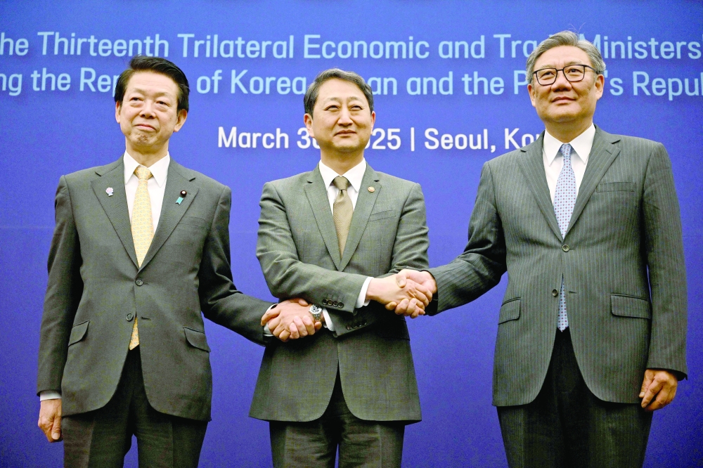 Delegates attend the 13th Trilateral Economic and Trade Ministers' Meeting in Seoul. — AFP