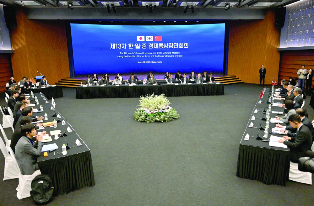 Delegates attend the 13th Trilateral Economic and Trade Ministers' Meeting in Seoul. — AFP