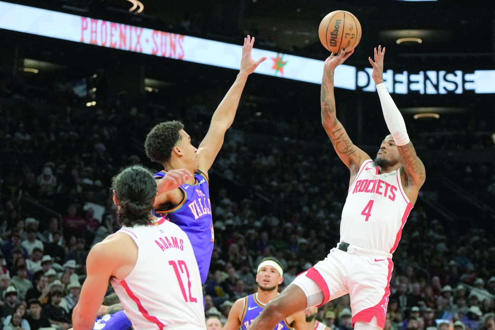Houston Rockets guard Jalen Green (4) shoots against the Phoenix Suns in the first half at Footprint Center. Mandatory Credit: Rick Scuteri-Imagn Images