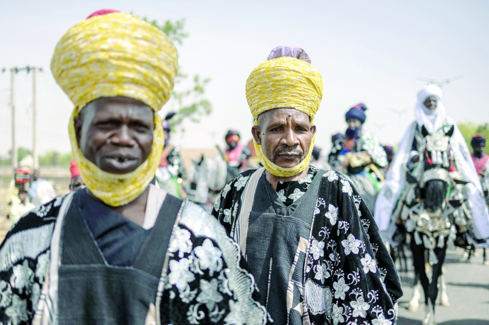 Members of the royal guard parade during the Durbar horse procession in Dutse. — AFP