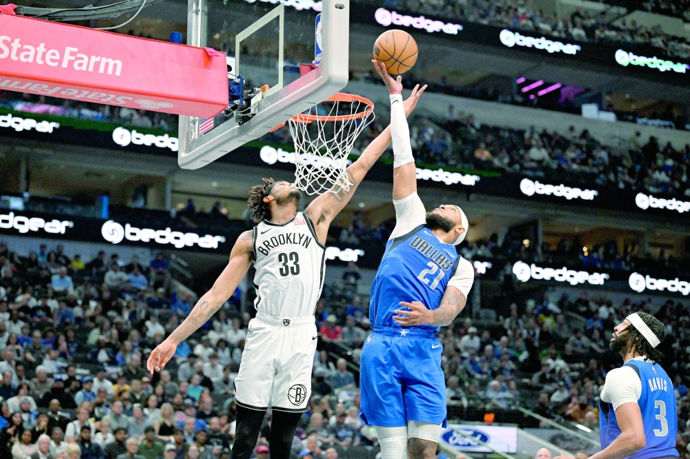 Mar 31, 2025; Dallas, Texas, USA; Brooklyn Nets center Nic Claxton (33) and Dallas Mavericks center Daniel Gafford (21) battle for the rebound during the second half at the American Airlines Center. Mandatory Credit: Jerome Miron-Imagn Images
