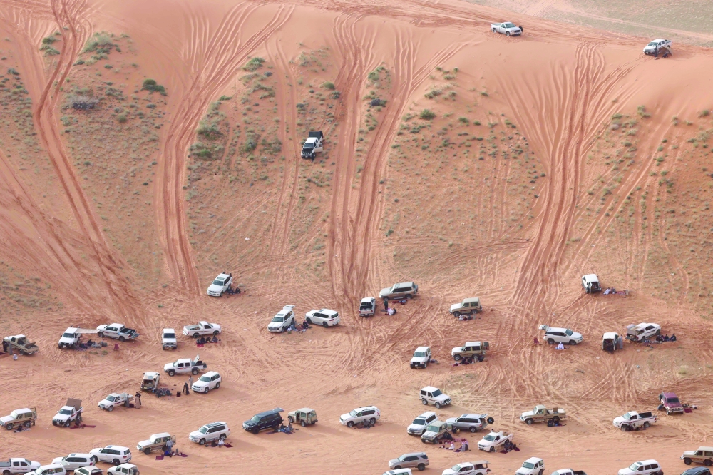 Saudis gather to watch a drifting competition in the Quseiba area. — AFP