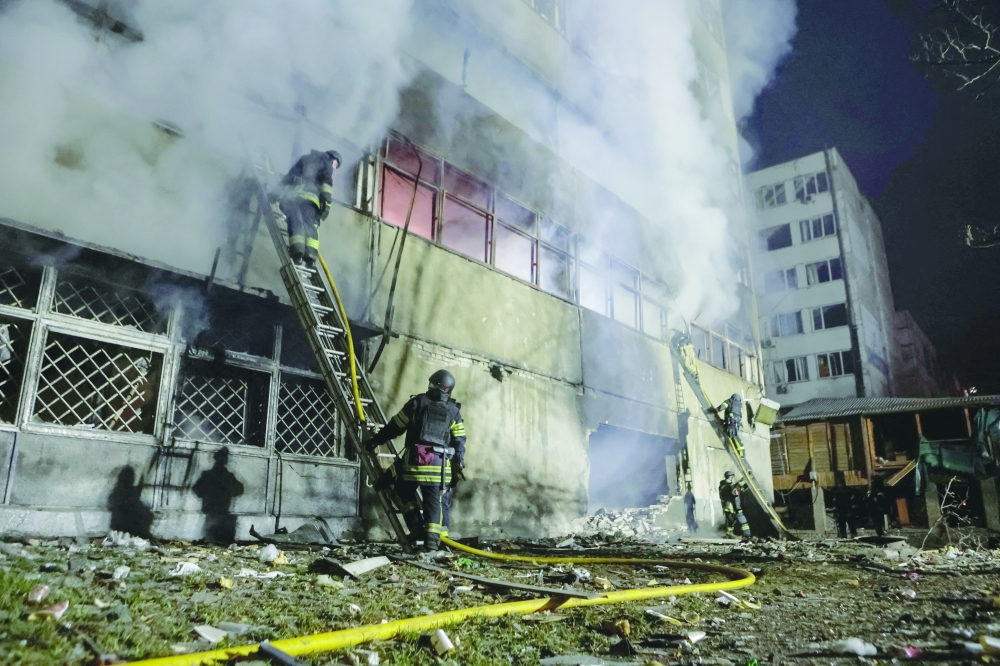 Firefighters work at the site of a Russian drone strike, amid Russia's attack on Ukraine, in Kharkiv. — Reuters