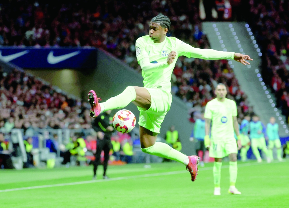 Barcelona's Spanish defender Alex Balde jumps to control the ball during the Spanish Copa del Rey semifinal second leg football match. — AFP
